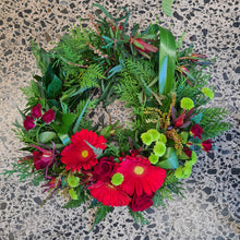 Load image into Gallery viewer, Medium ANZAC wreath by Blanc Flowers in red and green features NZ and Australian native plants with an arc of flowers
