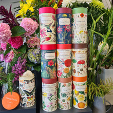 Load image into Gallery viewer, Blanc Flowers collection of beautifully presented Vintage style Cavallini & Co Puzzles in cardboard cylinders.