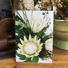 Load image into Gallery viewer, blanc card featuring close up image of classic blanc signature arrangement  showing lovely white proteas
