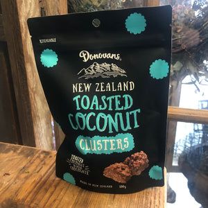 At Blanc Flowers we all love Donovans NZ Toasted Coconut Clusters, 150 g packet black packaging with yellow writing.
